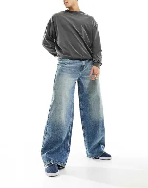 COLLUSION X003 wide leg jeans in midwash