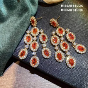 Paved Crystal Ruby Tassel Chandelier Earrings